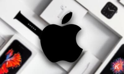 apple logo with apple products blurred in the background