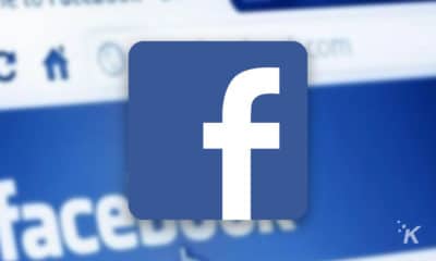 facebook logo with blurred facebook website in background