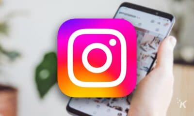 instagram logo with blurred phone background