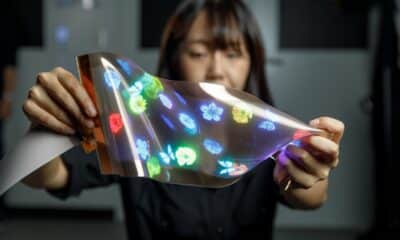 woman stretching LG's new OLED screen
