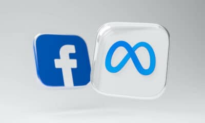 meta and facebook logo on grey background