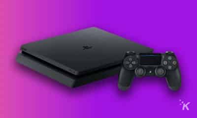 playstation 4 console on purple background