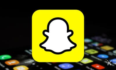 yellow snapchat logo with phone in the background