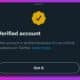 twitter gold verification badge notice on purple background