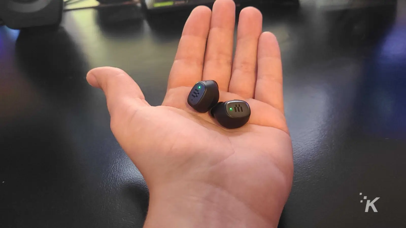 epos gtw 270 earbuds in hand