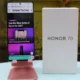 HONOR 70 phone on stand with KnowTechie website openned