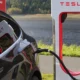 tesla car charging at charging station