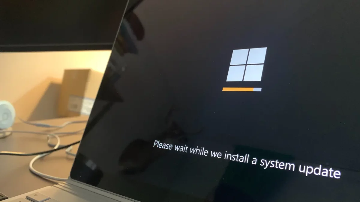 Windows 10 updating on a computer screen with logo